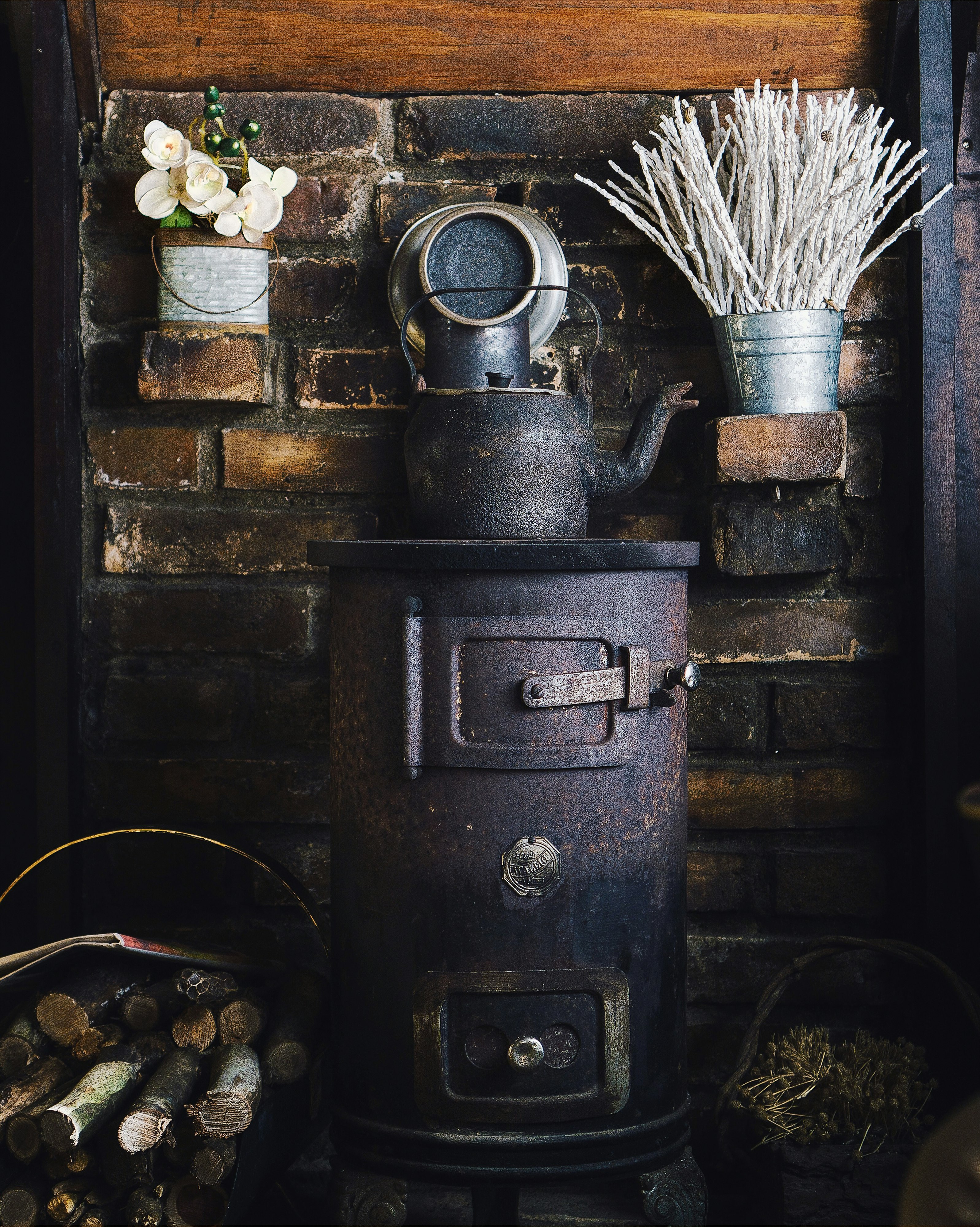 cast-iron teapot on wood burner